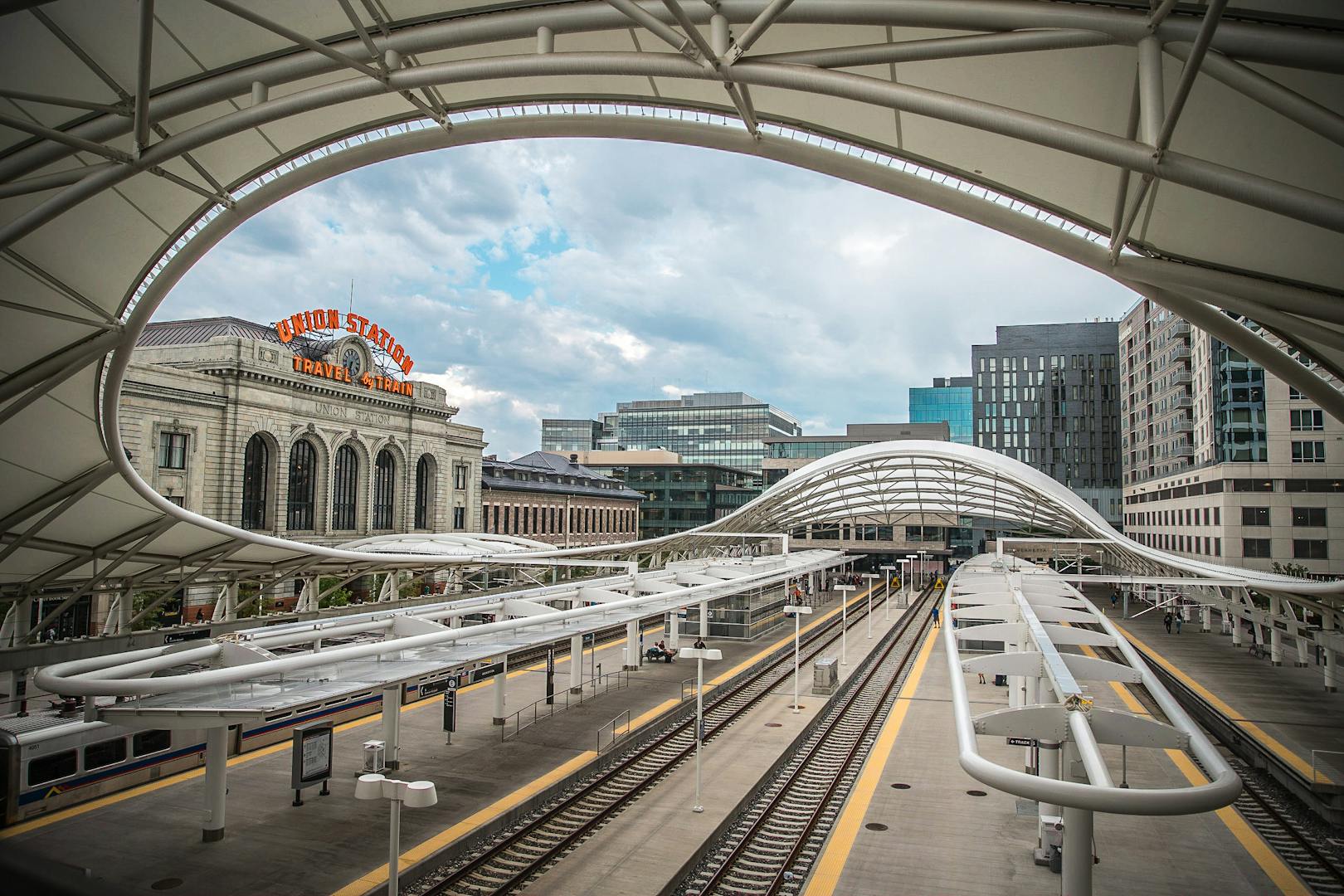 A striking view of Denver Union Station showcasing its modern architecture and urban surroundings.